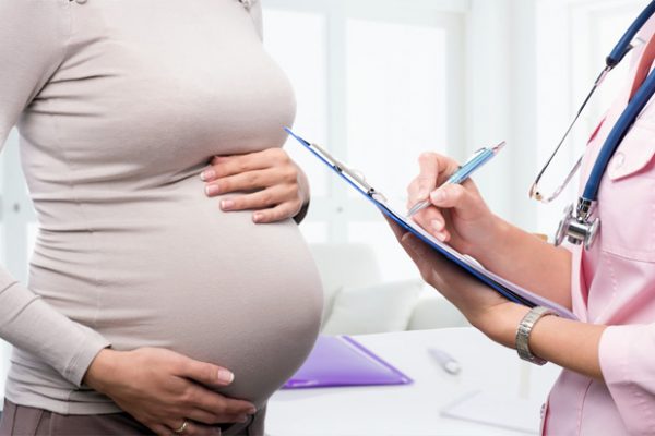 Pregnant Woman Consulting Obstetrician